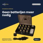 De Oplaadbare waxinelichtjes zwart set (12 stuks) bevat een zwarte oplaadbox, afstandsbediening en adapter. Tot 400 uur merkduur. Tekst: "Geen batterijen meer nodig" - voor duurzame, oplaadbare verlichting.